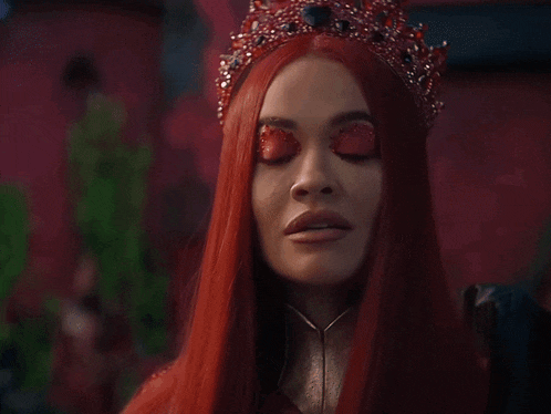a woman with red hair and a crown on her head has red eyes