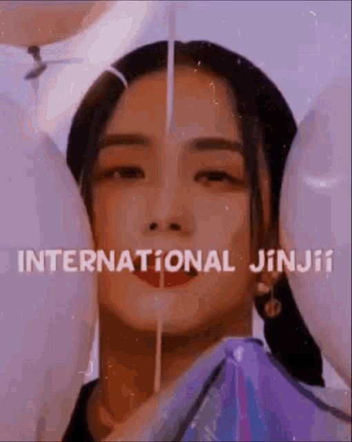a close up of a woman 's face with balloons and the words international jinji on the bottom