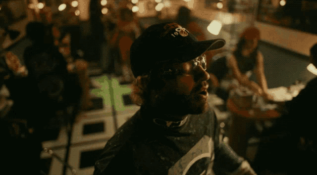 a man wearing glasses and a hat that says chicago