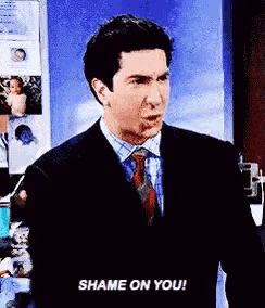 a man in a suit and tie says shame on you .