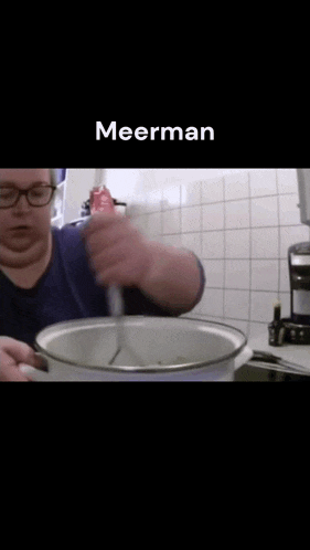 a woman is stirring something in a pot and the word meerman is on the bottom of the screen