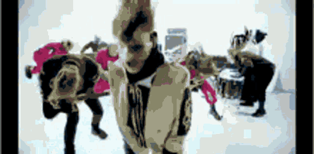 a group of people are dancing on a white background .