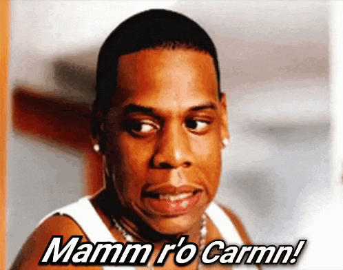 a man in a white tank top says mamm r'o carmn !