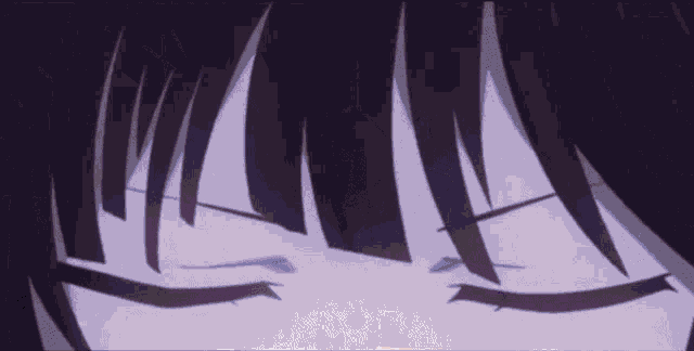 a close up of a person 's face with their eyes closed and purple hair .
