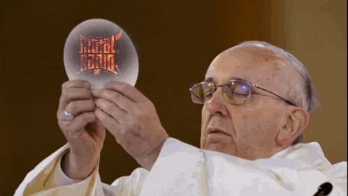 a man in a white robe is holding a crystal ball with the words metal radio on it