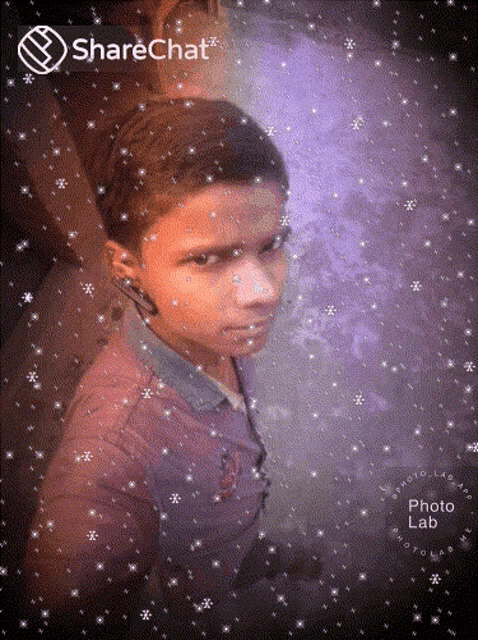 a boy 's face is surrounded by snowflakes and says sharechat