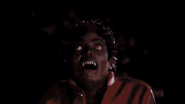 a close up of a child 's face with a shocked look on her face .
