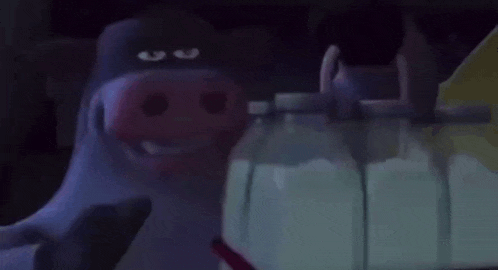 a cartoon pig with a pink nose is standing next to a bottle of milk .