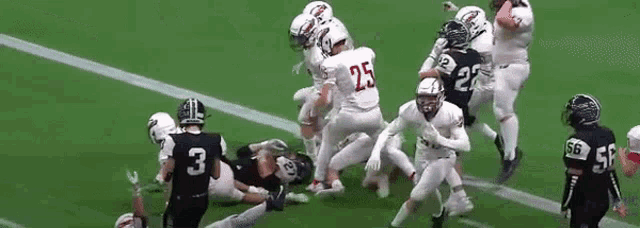 a group of football players are playing a game on a field . one of the players has the number 25 on his jersey .