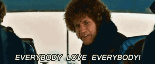a man with curly hair says " everybody love everybody " while sitting on a bus