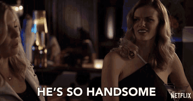 a woman says he 's so handsome in front of a netflix logo