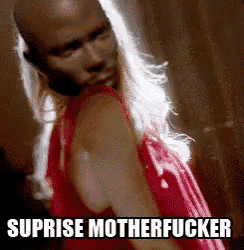 a man in a red dress with the words suprise motherfucker written on the bottom