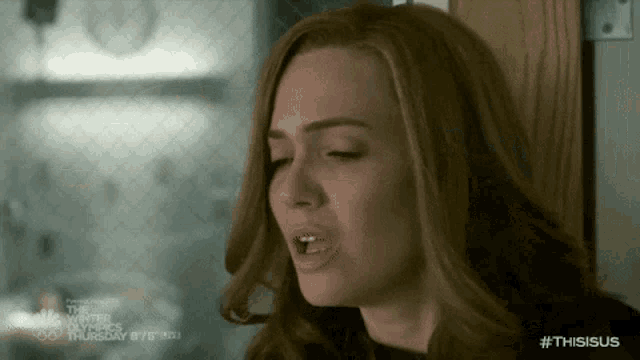 a close up of a woman 's face with the word thisisus on the bottom