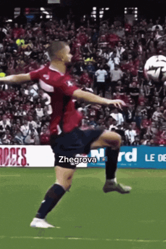 a soccer player with the name zhegrova written on his shorts