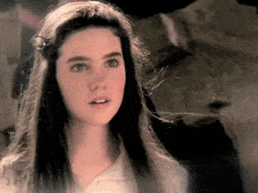a close up of a woman with long hair