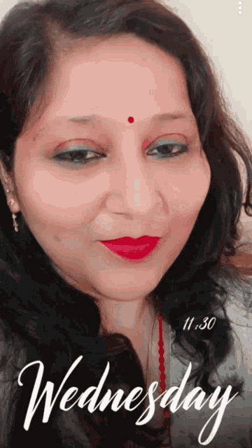 a woman 's face is displayed with the words wednesday written below her