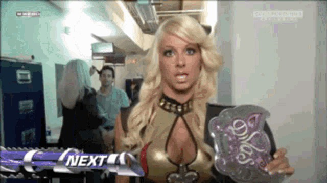 a blonde woman is holding a belt that says ' o'neal ' on it