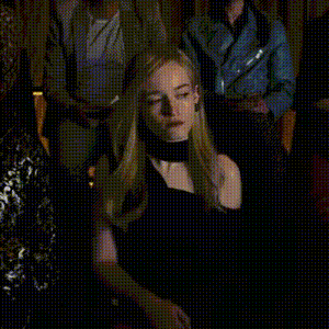 a woman in a white dress is standing in front of a crowd of people with the words if you want a job written above her