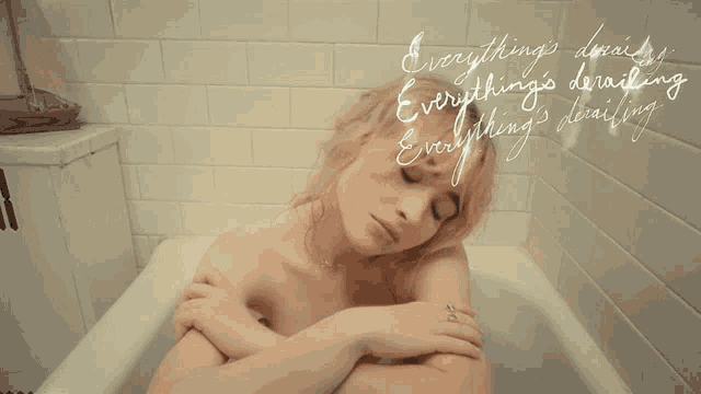 a woman in a bathtub with the words " everything 's derailing everything 's daring " on the bottom