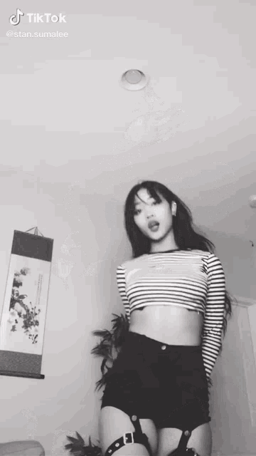 a black and white photo of a woman with a tiktok sticker