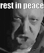 a black and white photo of a man with the words `` rest in peace '' written on it .