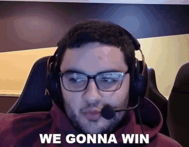a man wearing glasses and a headset says we gonna win