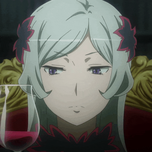 a girl with a flower in her hair is sitting next to a glass of wine