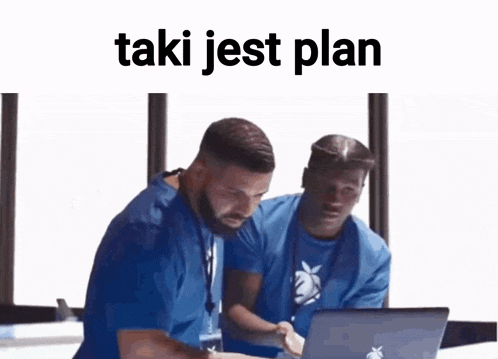 two men looking at a laptop with the words taki jest plan written on the bottom
