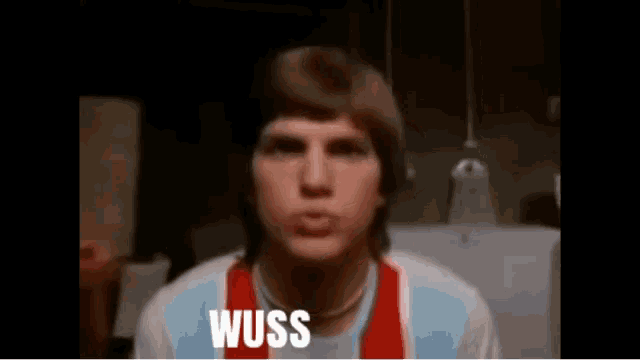 a man is wearing a shirt that says ' weiss ' on it