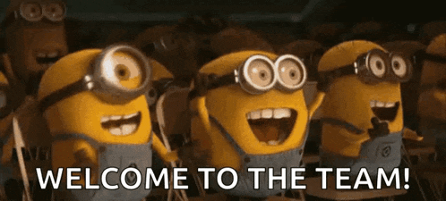 a group of minions are standing in a line with the words welcome to the team