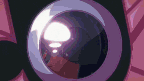 a close up of a purple object with a light coming out of it .