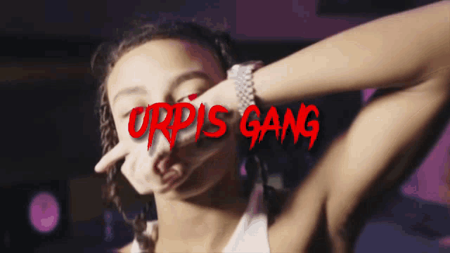 a woman covering her face with her hands with the words urpis gang written on the bottom