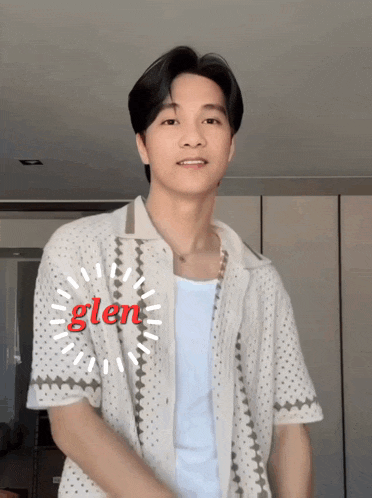 a man wearing a white shirt with the word glen written on it