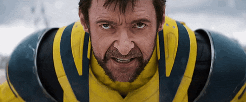 a man with a beard is wearing a yellow and blue costume
