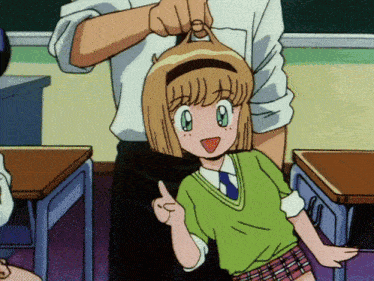 a girl in a green sweater and plaid skirt is pointing up