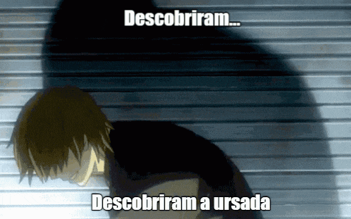 a shadow of a person is behind a sign that says " descubriram descubriram a ursala "