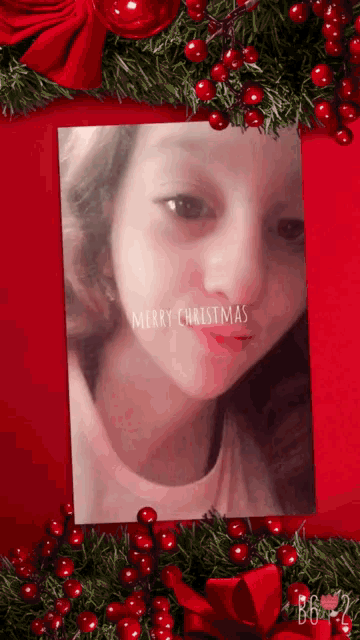 a merry christmas card with a picture of a girl on it