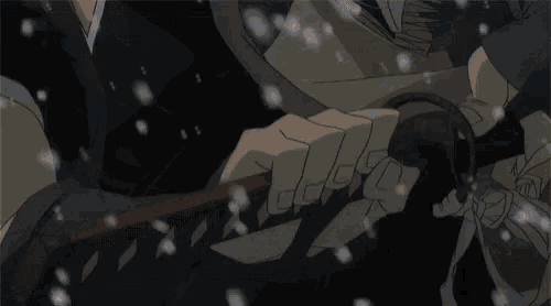 a person holding a sword in their hand with snow falling around them