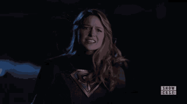 a woman in a superman costume is featured in a show case