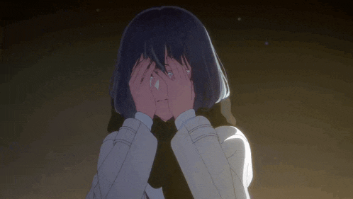 a girl with a scarf around her neck is crying