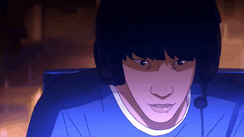 a man wearing headphones and a microphone looks at something