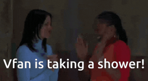 two women are giving each other a high five with the words vfan is taking a shower