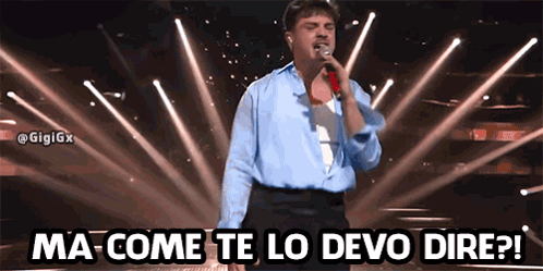 a man singing into a microphone with the words ma come te lo devo dire written above him