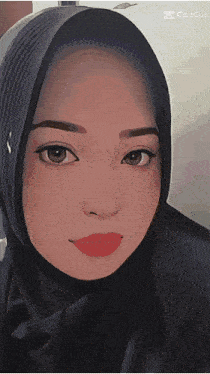 a close up of a woman wearing a hijab