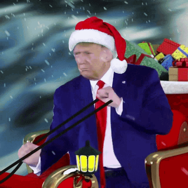 a man in a santa hat is sitting in a sleigh