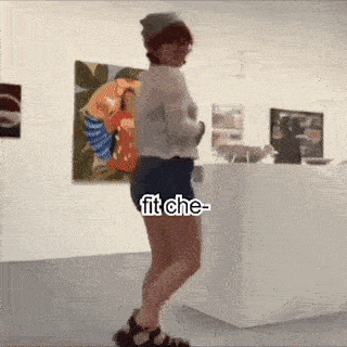 a woman in shorts and a hat is dancing in a museum with the words fit che written on the bottom