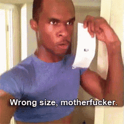 a man in a blue shirt is holding a piece of paper with the words wrong size motherfucker below him