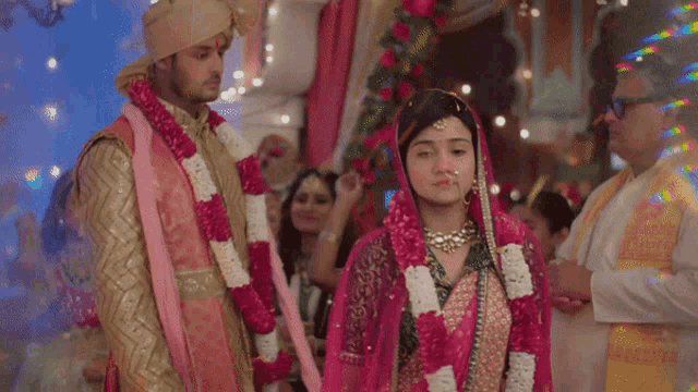 a bride and groom are standing next to each other at their wedding ceremony