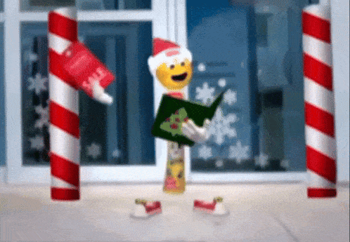 a christmas elf is holding a book and a tube of toothpaste .