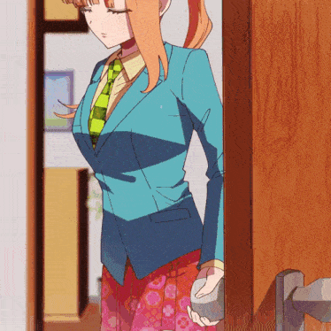 a girl in a blue jacket and green tie stands in a doorway